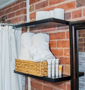Shower, hair dryer, towels, toilet paper