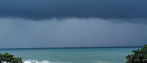 On the beach, white sand, free beach cabanas, beach umbrellas