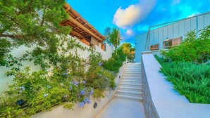 A staircase leading up to a building with a wooden pergola and lush greenery. - Spacious 4-Bedroom Villa for 8, with heated pool and sea views (Bobovisca)