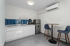 Fridge, microwave, stovetop, coffee/tea maker