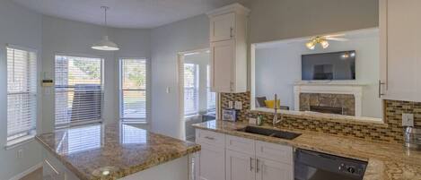 Fridge, microwave, dishwasher, cookware/dishes/utensils