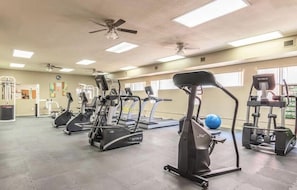 A gym with treadmills, elliptical machines, and free weights. - CASA RANCHERO: Cowboy up, golf course view. (Phoenix, Arizona)