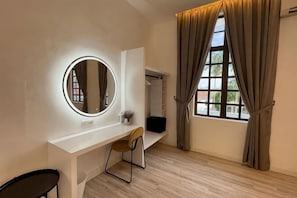 A room with a white desk, a round mirror with lights, a chair, a window with curtains, and a wardrobe. - The Luxurious 168 Cruise, Melaka (Melaka)