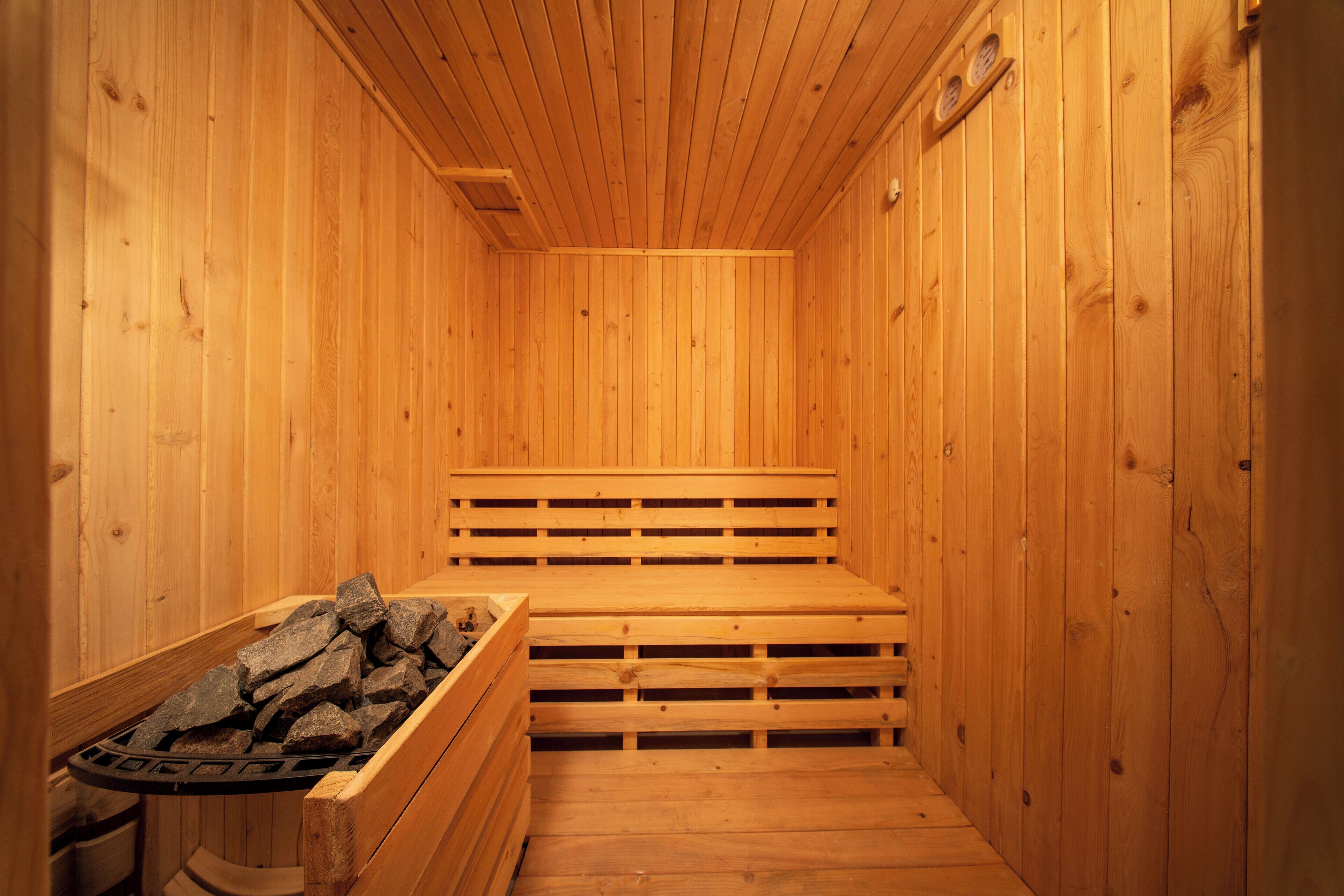 A sauna with wooden walls and benches.