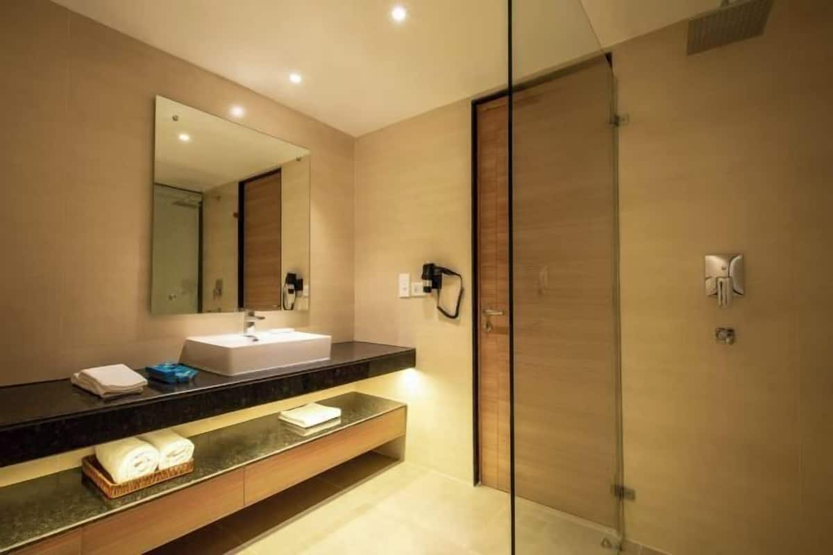 Bathroom | Shower, rainfall showerhead, hair dryer, bathrobes
