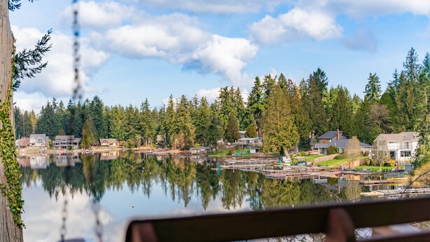 A lakeside view with houses and docks. - Cozy, comfortable, peaceful, unique lakeside house w beautiful views/Olympia (Lacey)