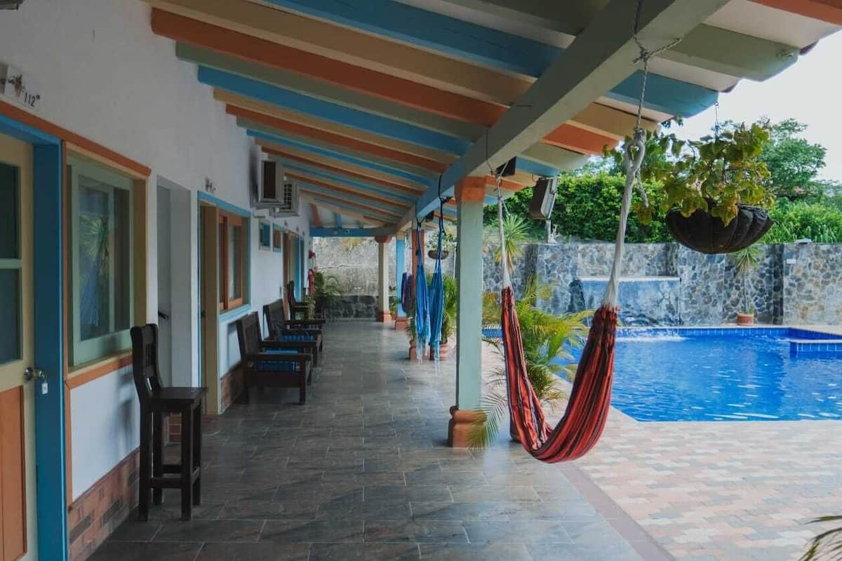 Economy Quadruple Room, Courtyard View | Living area