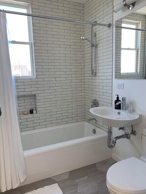 Shower, hair dryer, towels, soap