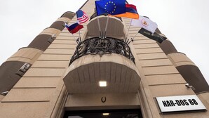 A building with flags, including the American, European Union, and others, and a sign reading "MAR-DOS 88". - Horizon Hotel Yerevan (Yerevan)