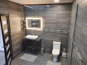 Shower, jetted bath, towels, soap