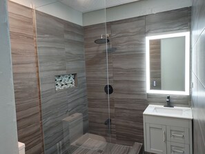 Shower, towels, soap, toilet paper