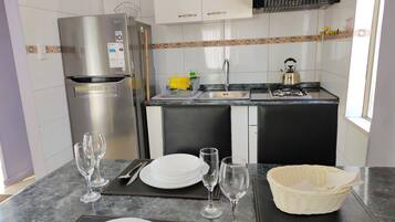 Classic Cabin | Private kitchen | Fridge, dishwasher, highchair