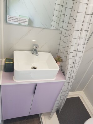 Shower, towels, soap, toilet paper