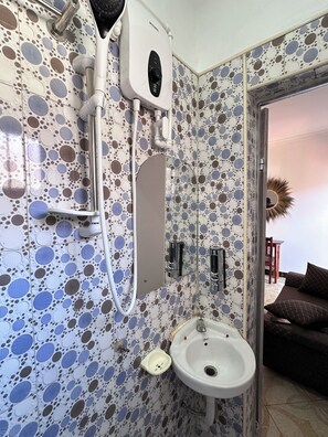 Shower, slippers, towels, soap