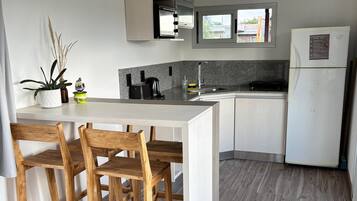 Fridge, oven, toaster, cookware/dishes/utensils