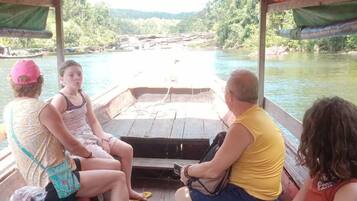 Relax on the boat's deck, taking in the serene views of the surrounding landscape.