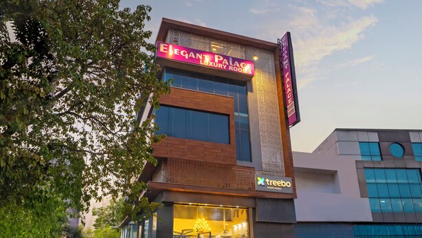 A building with a sign for 'Elegant Palace Luxury Rooms' and a 'treebo' logo. - Treebo Elegant Palace (New Delhi)