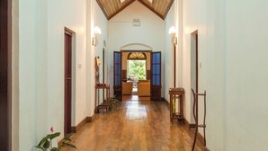 A hallway with wooden flooring and a sloped ceiling with skylights. - Iona Bungalow by Lalan Leisure  (Hatton)