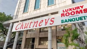 A building with a sign for 'Chutneys Luxury Rooms Banquets'. - HOTEL CHUTNEYS (Hyderabad)