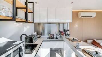 Fridge, microwave, coffee/tea maker, toaster