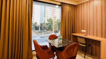 Deluxe Double Room, City View | Living area | TV, printers