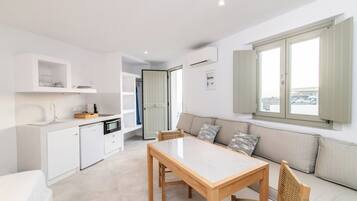 Superior Studio, Sea View | Living area | TV