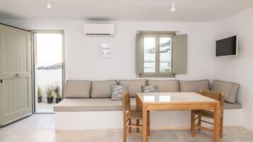 Superior Studio, Sea View | Living area | TV