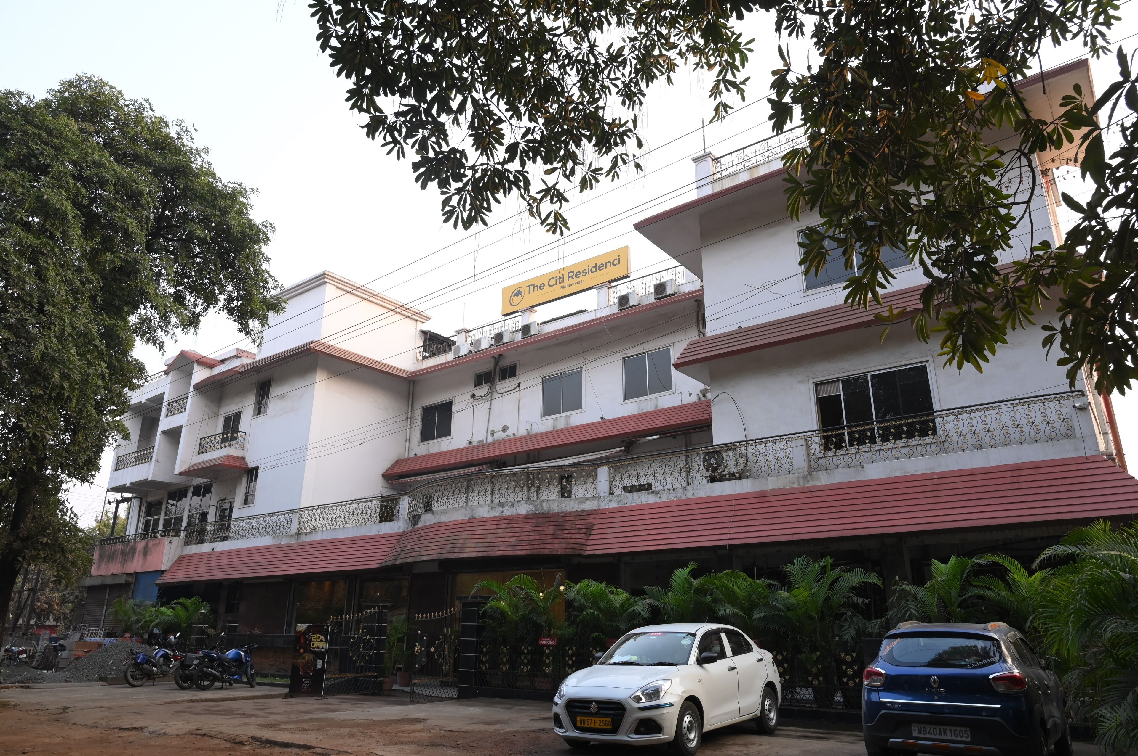 A multi-story building with a sign reading "The Citi Residensi".