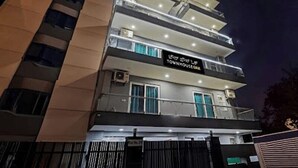 A multi-story building with a sign reading "Townhouse Hotel". - Akshay Dream Stay (Gurugram)