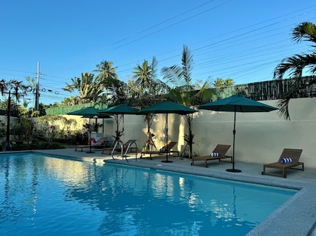 Outdoor pool, open 7:00 AM to 7:00 PM, pool umbrellas, sun loungers