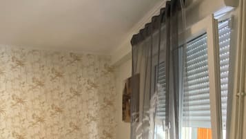 1 bedroom, desk, iron/ironing board, travel crib