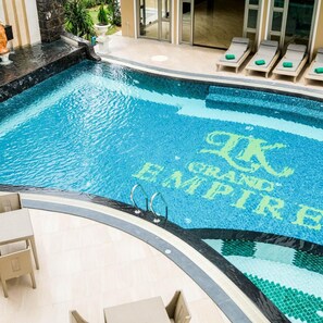 A swimming pool with a tiled pattern and the words 'Grand Empire' visible. - LK Grand Empire (Pattaya)