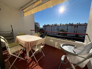 Enjoy a romantic meal for two on the balcony with a table set amidst a beautiful view.