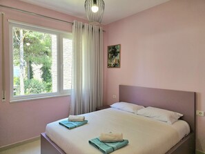 2 dormitorios, tabla de planchar con plancha, wifi gratis y ropa de cama