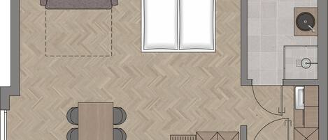 A floor plan of a hotel room with a bed, a sitting area with a sofa and a table, a small kitchenette, and a bathroom.