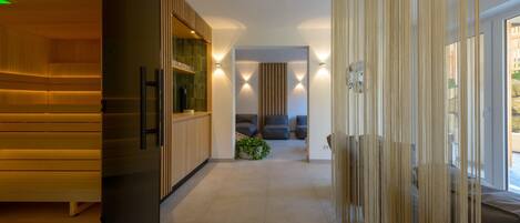 A modern kitchen with wooden cabinets and a built-in refrigerator.