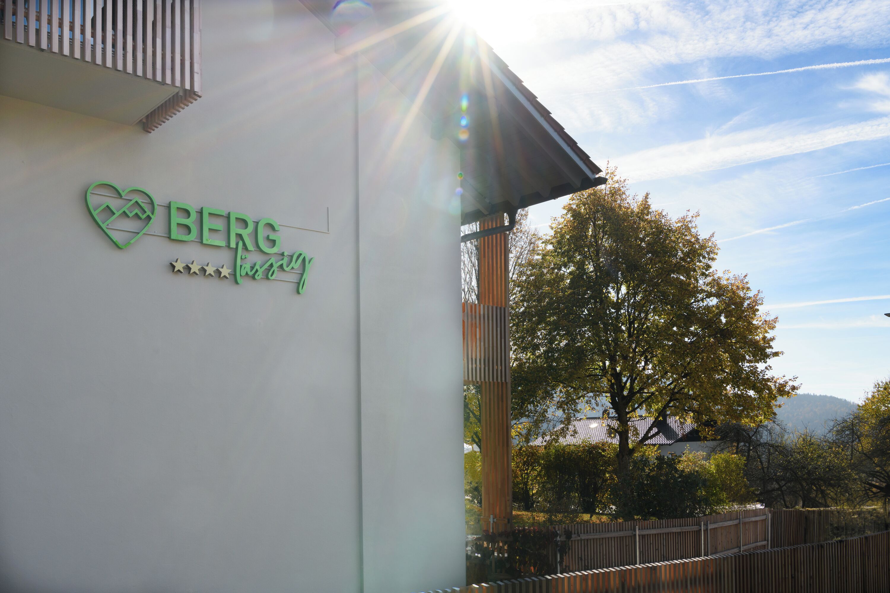 A building with a sign that reads "BERG" and a heart symbol.