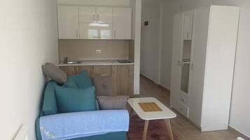 Classic Studio, Garden View | Living area | 32-inch LCD TV with cable channels