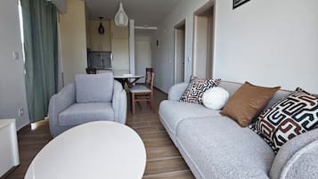 Comfort Apartment | Living room | 32-inch LCD TV with cable channels