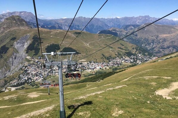 A cable car system with a town below.