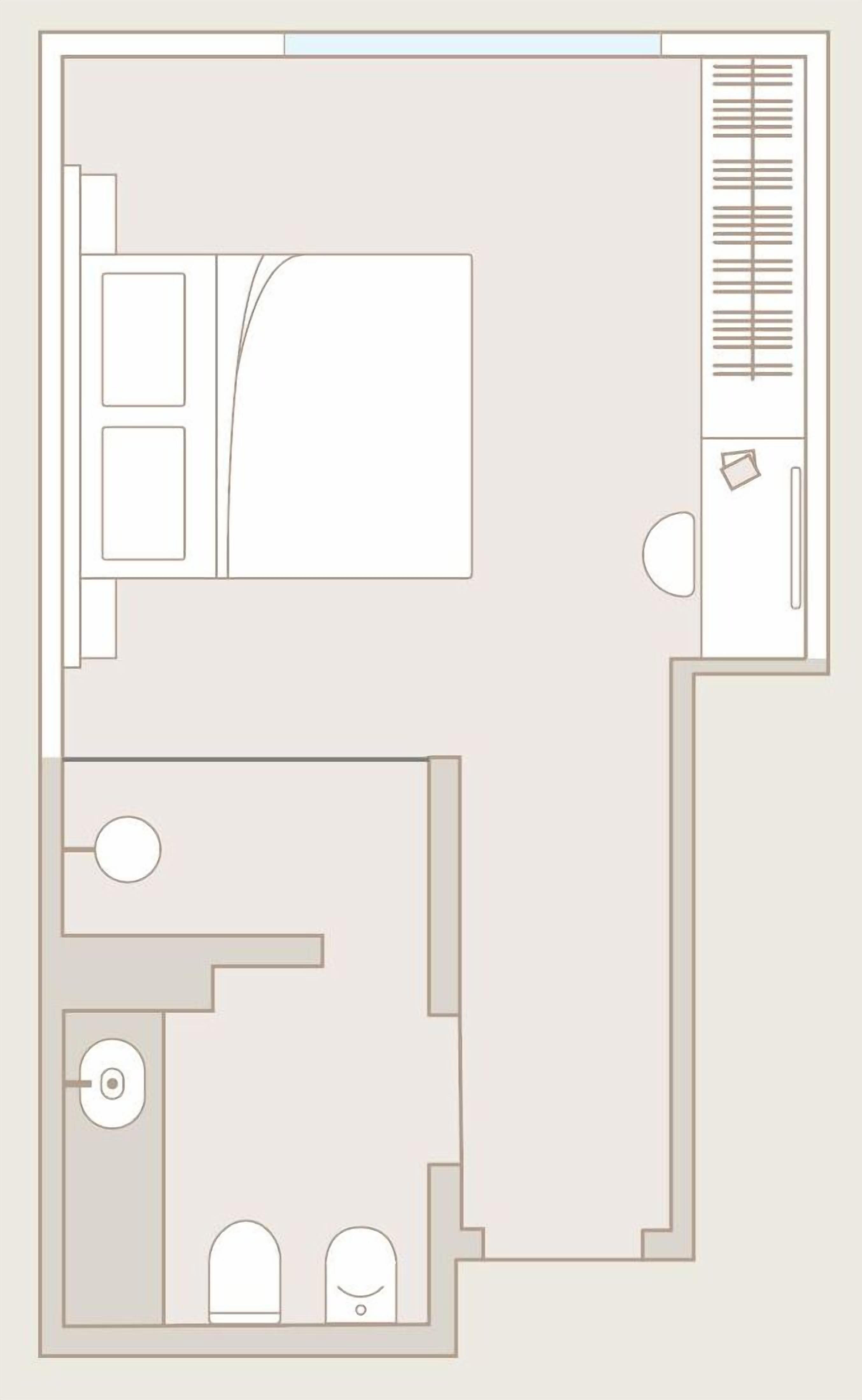 A floor plan with a large bedroom, a bathroom, a kitchen, and a living area.