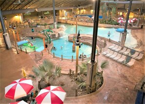 An indoor water park with multiple pools, slides, and lounge areas. - Doc Harmony Lake Front / Beach / Hot Tub / Fishing (Lake Harmony)