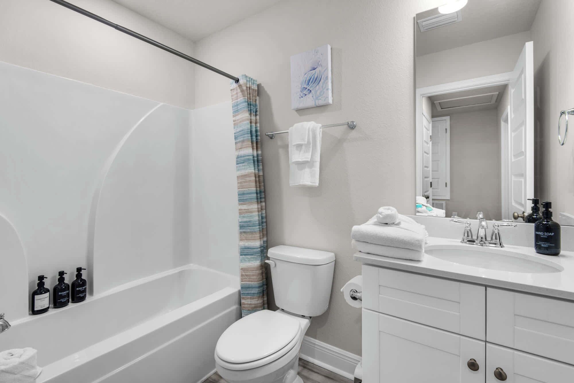 Shower, hair dryer, towels, shampoo