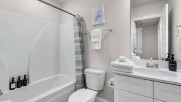 Shower, hair dryer, towels, shampoo