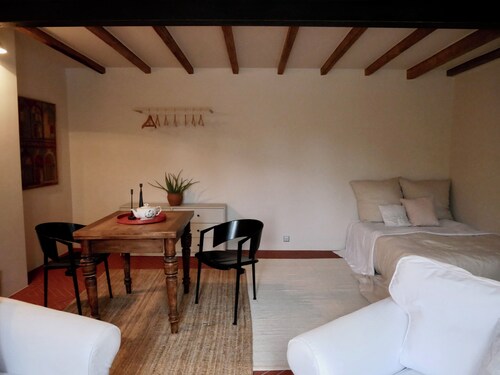 Comfortable living on a farm surrounded by greenery and art