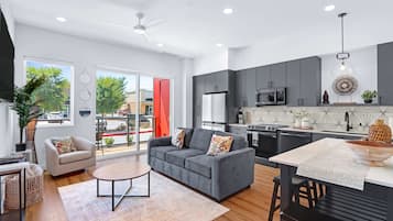 Condo, 1 Double Bed with Sofa bed, Balcony, City View (The Mercer Haus) | Living area | 50-inch flat-screen TV with digital channels