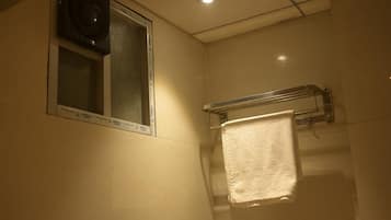 Shower, towels, soap, toilet paper