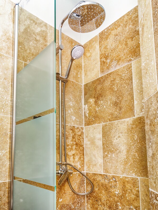 Shower, towels, soap, toilet paper