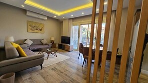 Appartement Élite | Coin séjour | Télévision à écran plat