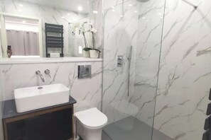 Shower, hair dryer, towels, soap